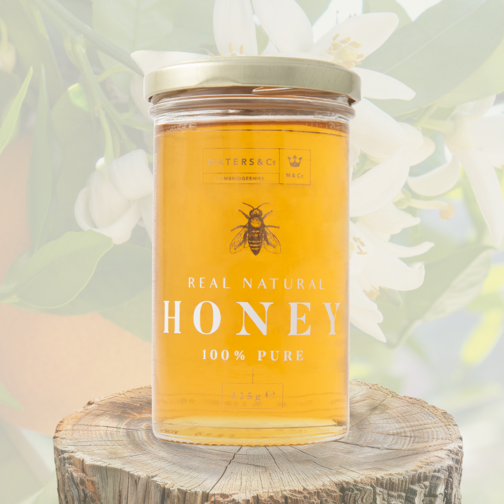 Maters and Co Great Taste Award Winning Orange Blossom Honey - Pale golden nectar in glass.