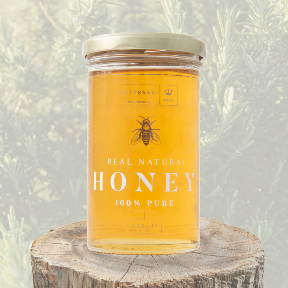 Maters and Co Delicate Rosemary Honey - Clear pale golden liquid honey in a luxury glass jar.